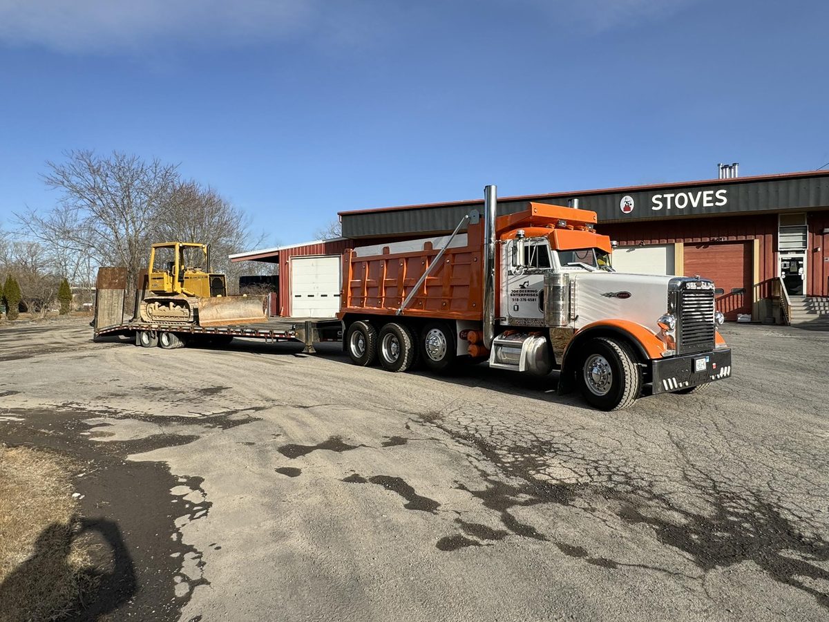 Joe Deering truck hauling bulldozer